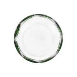 Glas met groene stippen