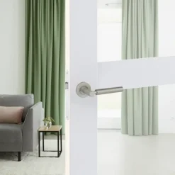 Karwei deurkruk set Adam rond rozet RVS